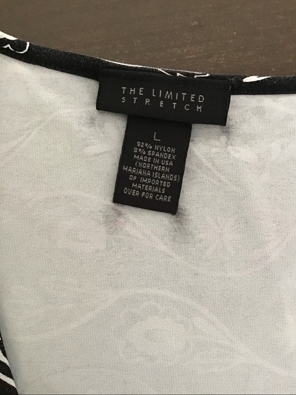 Y2K The Limited black V-neck tank top featuring a white and pink floral vine. - Picture 3 of 7